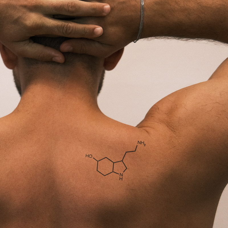 Serotonin and dopamine chemical structure tattoo under